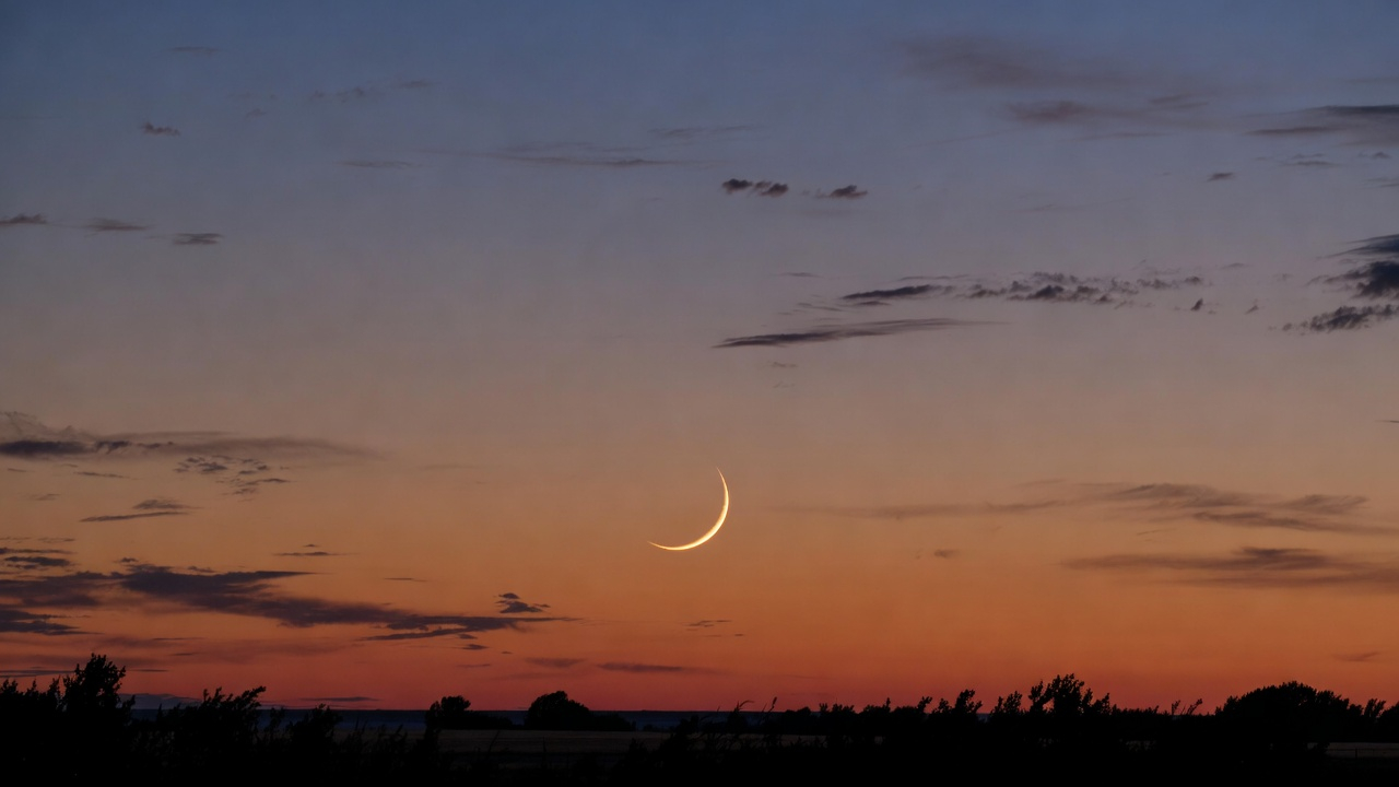 New crescent moon at sunset
